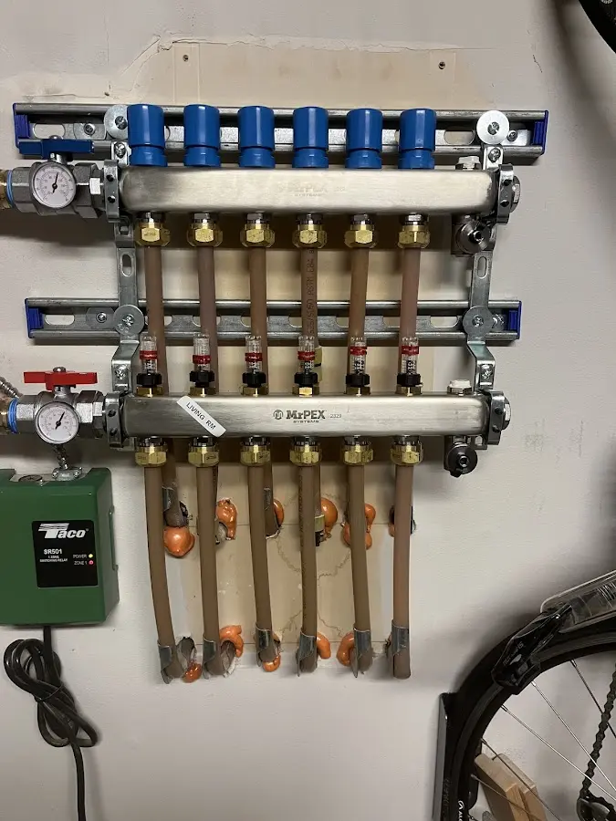 Plumber performing Water Heater Repair at a residential property in Nowthen